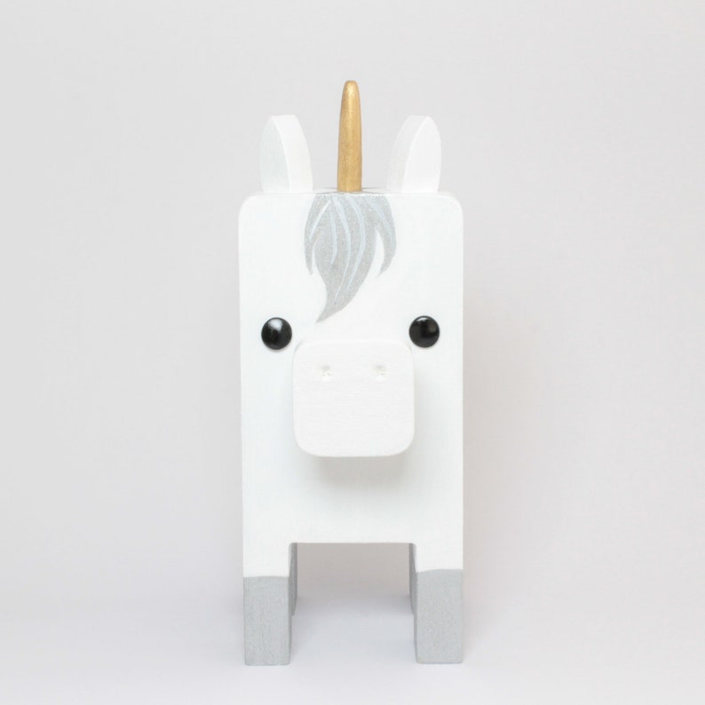 White Unicorn Wearing Eyeglasses Stand.