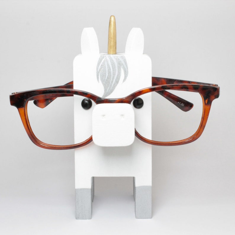 White Unicorn Wearing Eyeglasses Stand.